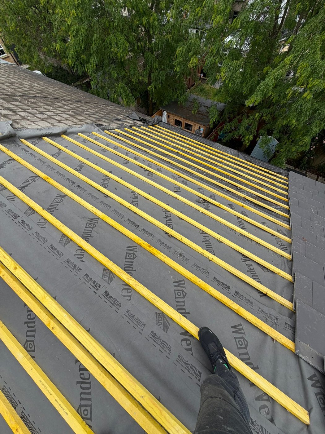 New roof underlay and yellow battens fitted on the pitched roof