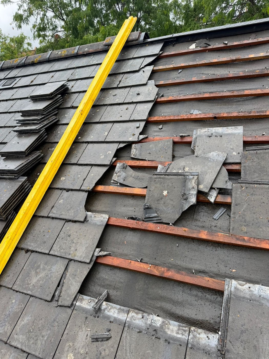Roof covering removed to reveal the existing battens